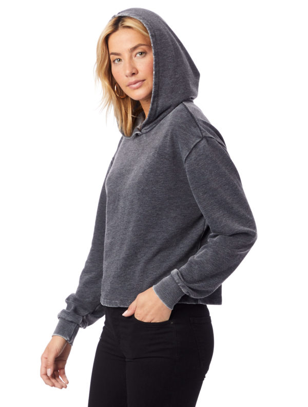 Blonde woman in grey hoodie and black jeans