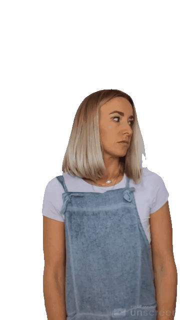 Animated gif of a blond woman with a pale purple shirt and denim overalls shrugs
